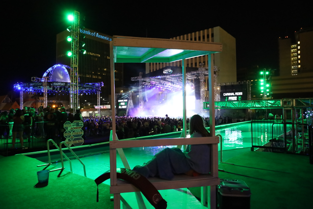 A lifeguard watches over a mostly empty pool at Alienstock in Las Vegas